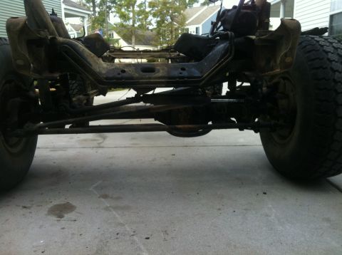 1979 Ford Bronco - The undercarriage of a vehicle is shown, focusing on the frame and suspension components.