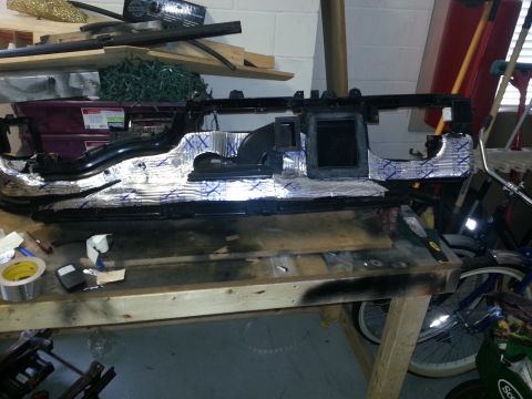 1994 Ford Bronco - Dashboard assembly covered in sound deadening material, likely undergoing modification or repair.