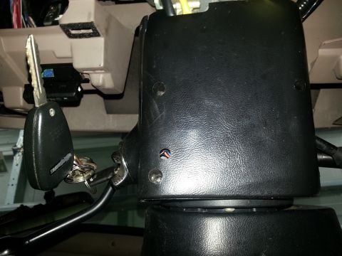 1994 Ford Bronco - Key in the ignition cylinder of a vehicle's steering column.