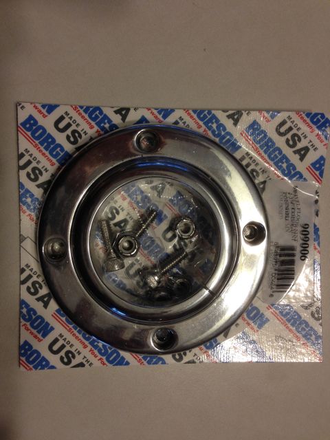 1964 Ford Fairlane - A chrome steering part and hardware are displayed in their original Borgeson packaging.