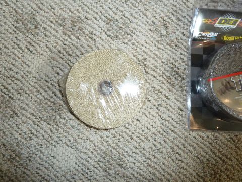 2007 Subaru Impreza - Exhaust wrap roll and its packaging are shown on a carpeted floor.