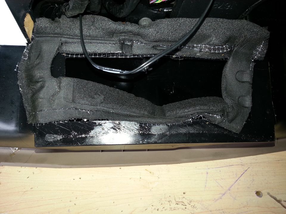 interior dashboard area with exposed wiring and foam padding