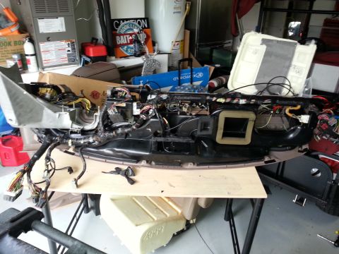 1994 Ford Bronco - Vehicle dashboard removed for repair or modification, showing complex wiring harness.