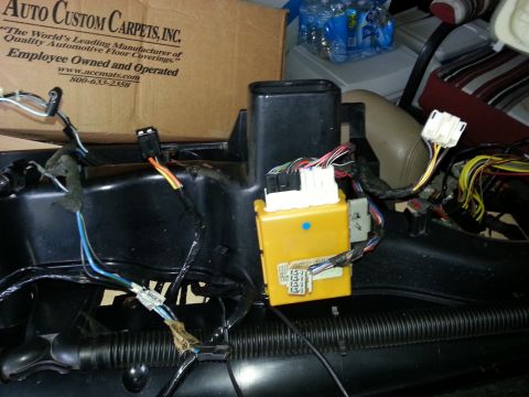 1994 Ford Bronco - Exposed wiring and electronic components are visible within the vehicle's dashboard area.