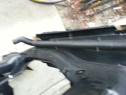 1994 Ford Bronco - Automotive ducting with a ribbed hose is visible in this close-up shot.