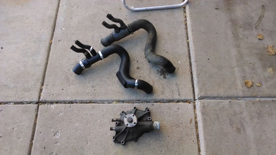 Engine water pump and hoses on concrete