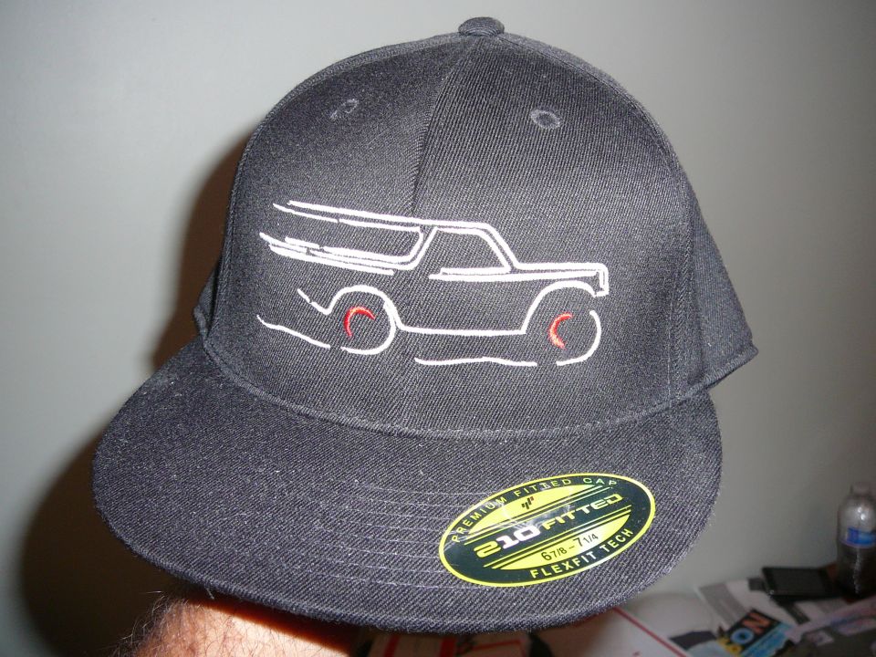 Black baseball cap with a white outline of a Bronco and red wheel details