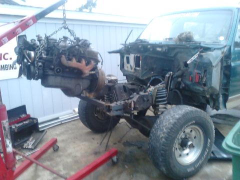 1996 Ford Bronco - after a few more hours on the first day I had the engine pulled. The frame being really bent made getting to the bell housing bolts very di…