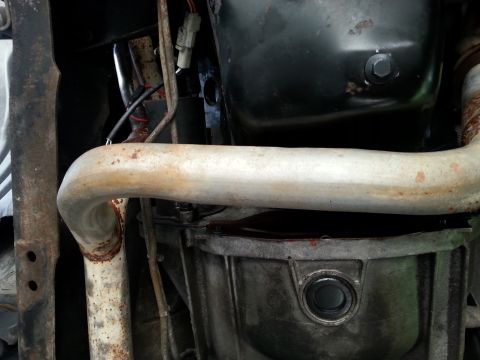 1992 Ford Bronco - Underside view of vehicle exhaust pipe and transmission pan.