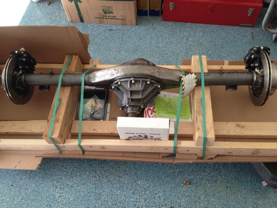 Rear axle assembly mounted on wooden supports