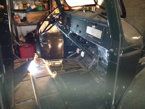 1947 International Scout II - Close-up view of an engine bay containing multiple components and tools.