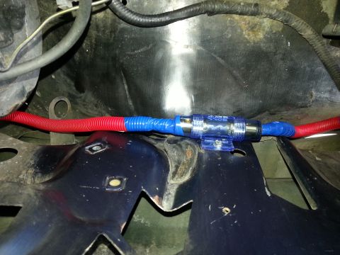 1994 Ford Bronco - An in-line fuse holder is shown connected to red and blue wiring.
