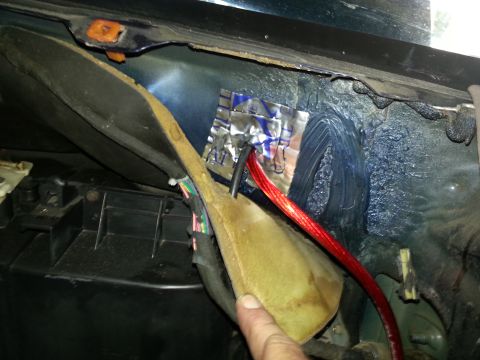 1994 Ford Bronco - This photo shows the interior of a vehicle with exposed wiring and insulation, likely related to audio system installation.