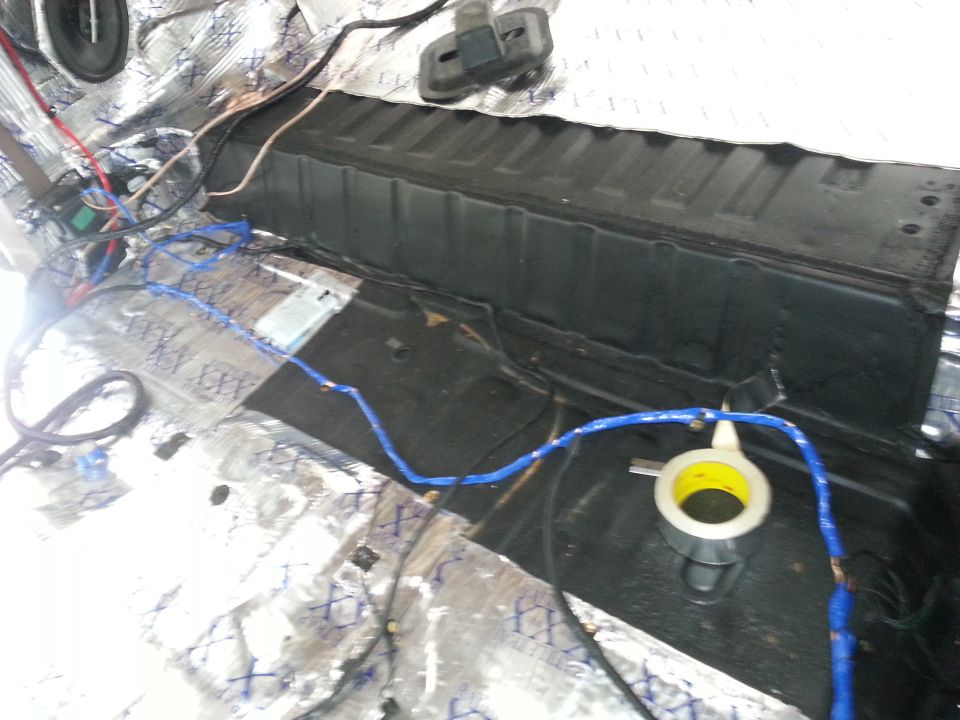 Interior wiring and sound dampening on vehicle floor