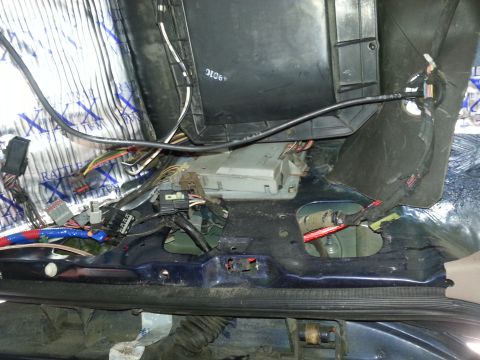 1994 Ford Bronco - Photograph of an under-dash HVAC and wiring area, not a technical document.