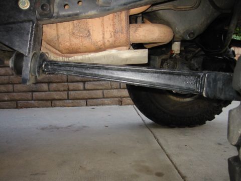1985 Ford Bronco - Undercarriage view of a 1985 Ford Bronco, highlighting suspension and exhaust system components.
