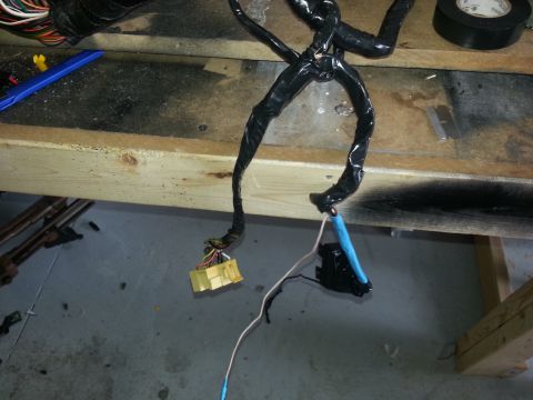 1994 Ford Bronco - Close-up of an automotive wiring harness, showing electrical connections and tape wrapping.
