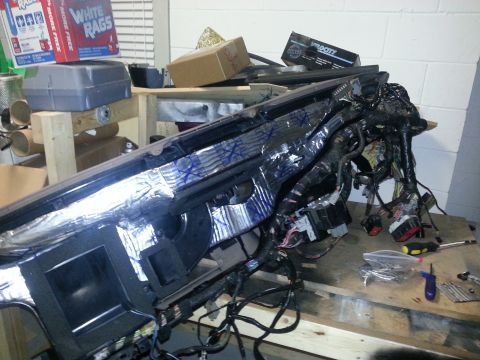 1994 Ford Bronco - Vehicle dashboard removed and disassembled, showing complex wiring and insulation.