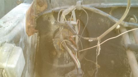 1979 Ford Bronco - Close-up of a tangled and corroded engine bay wiring harness.