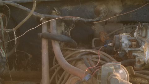 1979 Ford Bronco - Close-up view of the engine bay of a 1979 Ford Bronco, showing the carburetor and various wires.