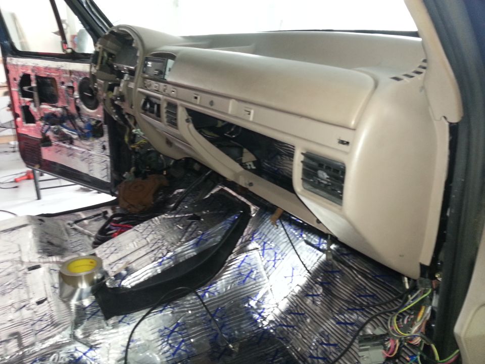 Photo of truck dashboard and floor covered in sound-deadening mat