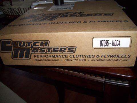 1995 Ford Probe - A cardboard box for Clutch Masters performance clutches & flywheels is shown, with a part number label reading "07095-HDC4". The box is sit…