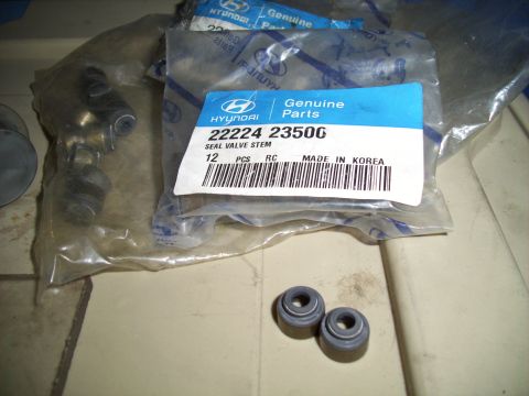 1995 Ford Probe - A package of Hyundai Genuine Parts, part number 22224 2350G, for seal valve stem, containing 12 pieces, is shown. Two small valve stem seal…