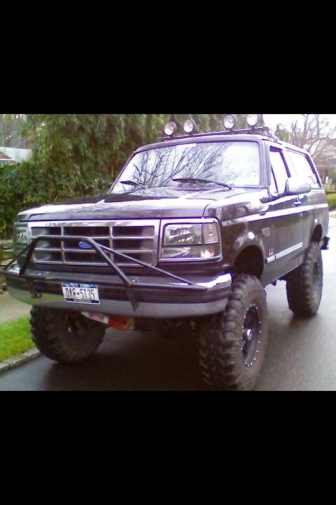1995 Ford Bronco - This 1995 Ford Bronco features off-road tires and a custom front bumper.