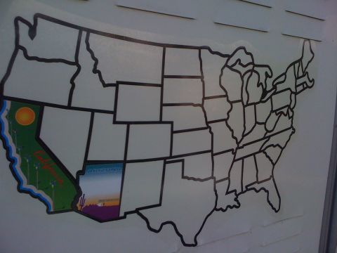 1997 Dodge 3500 - A map of the United States with California and Arizona highlighted with decorative stickers. The map is affixed to a white, horizontal-slat…
