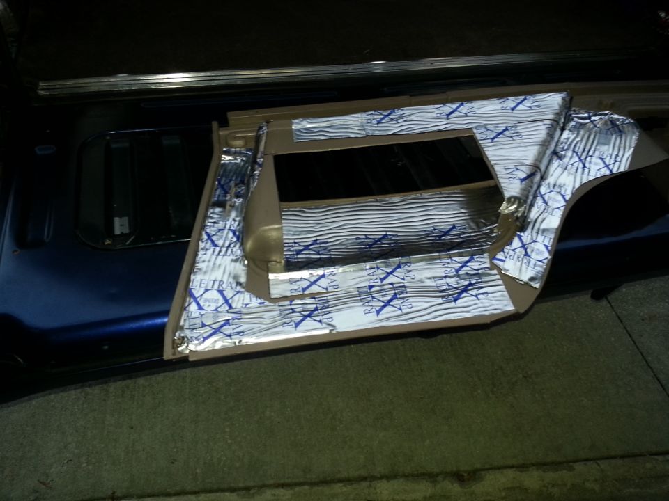 Vehicle interior panel covered with foil sound-deadening insulation