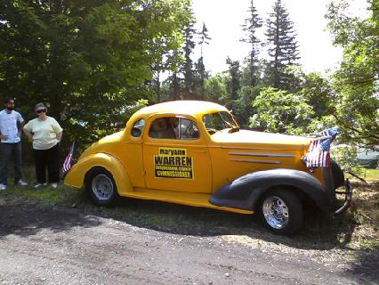 1935 Chevrolet New - Yellow 1936 Chevrolet coupe displays a political advertisement on its door.