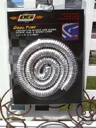 1935 Chevrolet New - DEF Cool-Tube packaging shows a coiled silver protective sleeve for automotive lines.