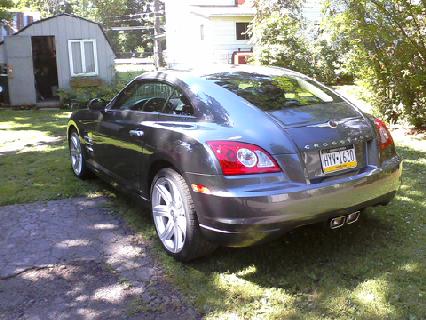2004 Chrysler Crossfire - Rear view of a 2004 Chrysler Crossfire parked in a residential yard.