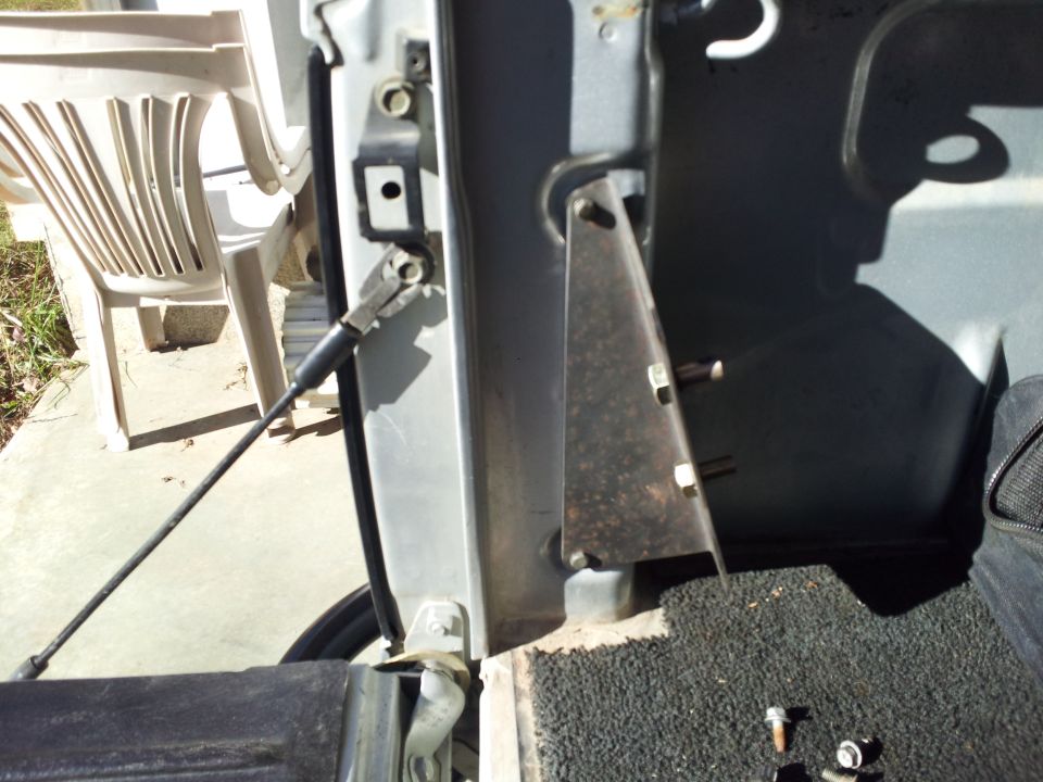 Close-up of a truck's door latch mechanism and striker plate