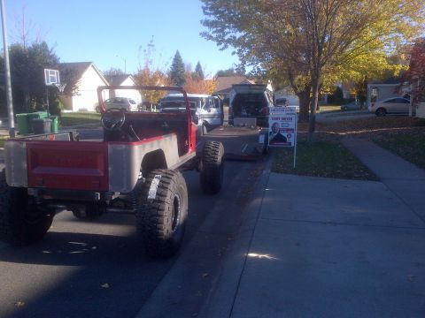 1985 Jeep CJ7 - This modified Jeep CJ-series, possibly a 1985 model, is equipped with oversized tires and appears to be undergoing some form of customizati…