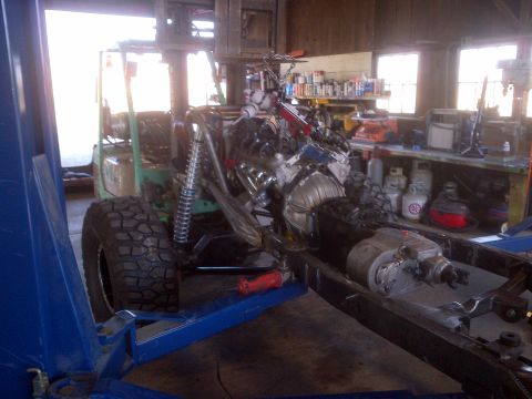 1985 Jeep CJ7 - Jeep CJ frame undergoing modification with engine and transmission assembly in place.
