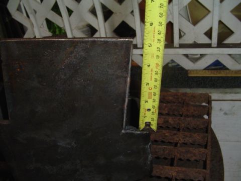 1993 Ford Bronco - A close-up view of a rusty metal component, with a tape measure indicating a dimension of about 2.5 inches.