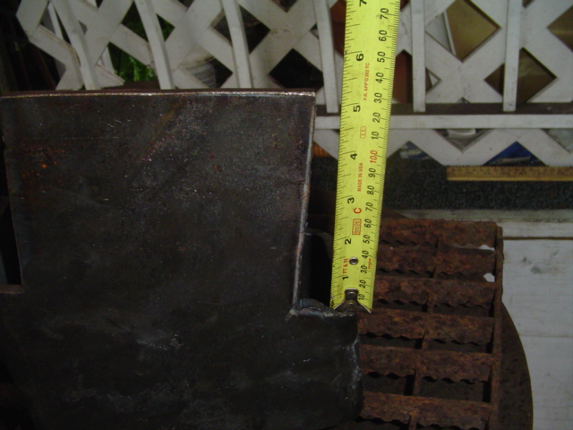 Rusty metal part with tape measure showing approximately 2.5 inches
