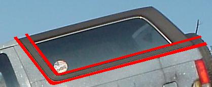 1989 Ford Bronco - The upper rear body and quarter window of a silver SUV, with red hand-drawn lines tracing the outline of the window opening and trim agains…