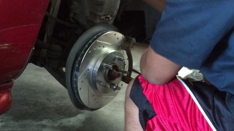 1996 Ford Taurus - Installing new drilled and slotted brake rotors and pads on a vehicle.