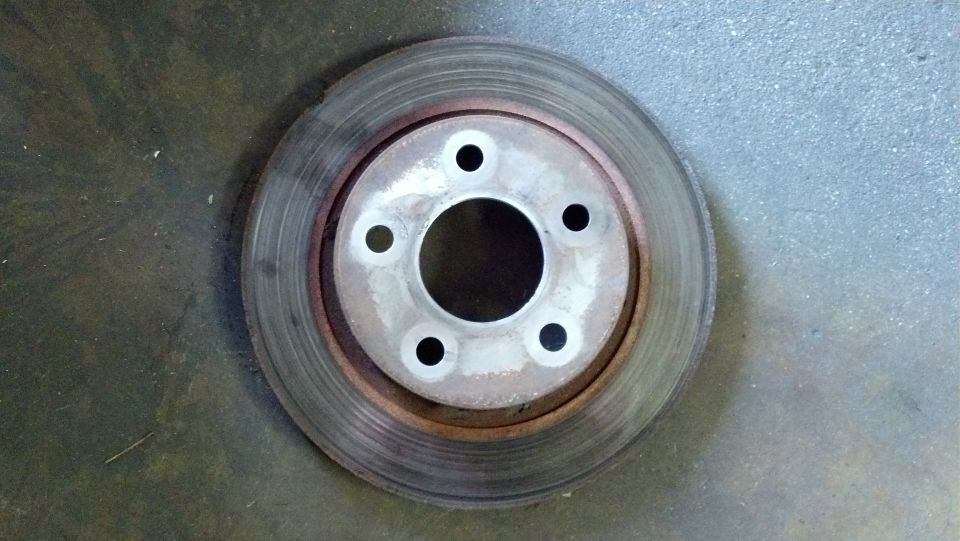 worn brake rotor with five bolt holes