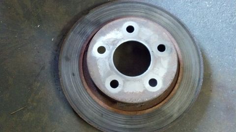 1996 Ford Taurus - A single brake rotor is shown, with rust and wear evident on its surface.