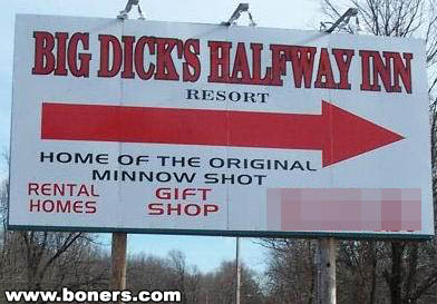 1979 Ford Bronco - A billboard for Big Dick's Halfway Inn Resort advertises rental homes and a gift shop with a large red arrow.