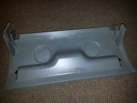 2002 Volkswagen Jetta - This is a gray plastic interior trim piece with two circular indentations and clips.