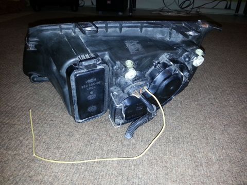 2002 Volkswagen Jetta - Headlight assembly part with visible part number, likely for a Volkswagen Jetta.