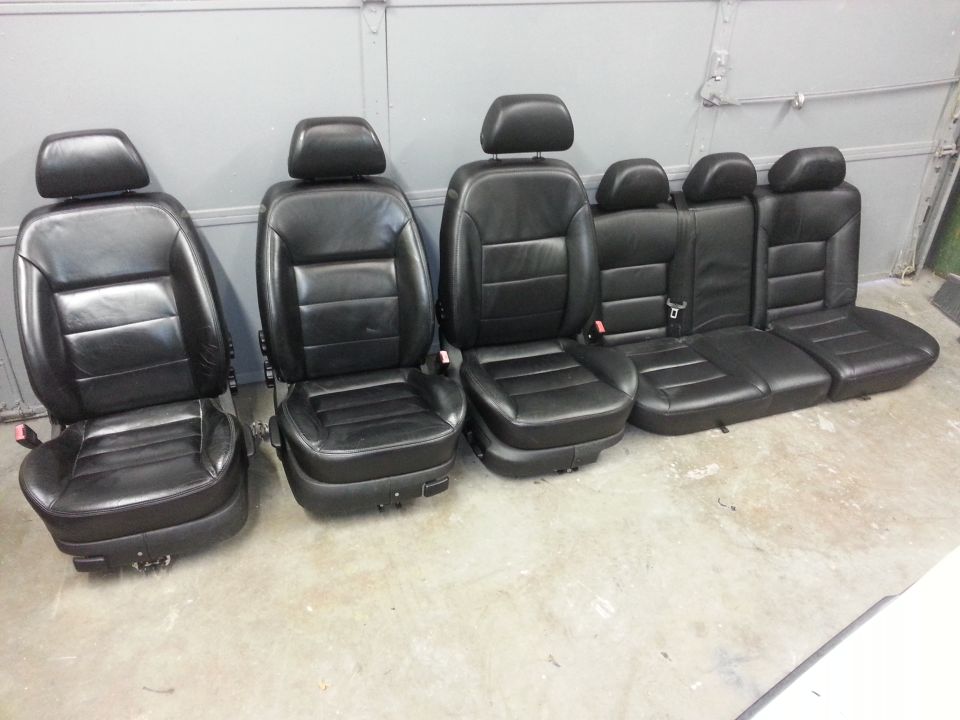 Black leather car seats, front and rear sections
