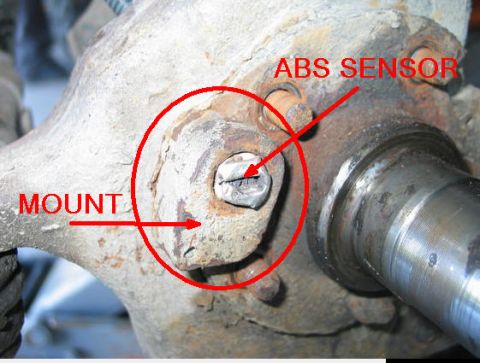 1993 Ford Bronco - This image shows a close-up of a vehicle's ABS sensor mount, highlighting the sensor itself.