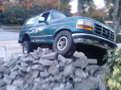 1996 Ford Bronco - there's a bunch of busted up concrete in my parking spot. what do you think im going to do? I love how my truck flexes better then a jeep