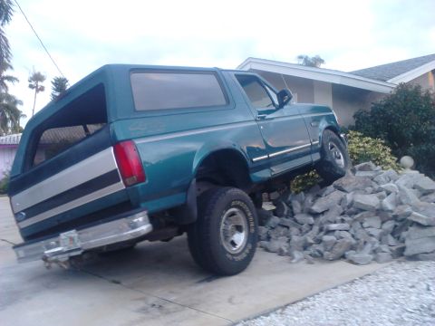 1996 Ford Bronco - there's a bunch of busted up concrete in my parking spot. what do you think im going to do? I love how my truck flexes better then a jeep