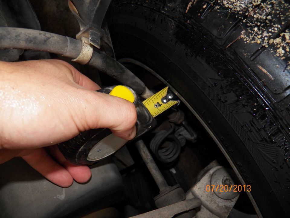 Measuring tire clearance with a tape measure